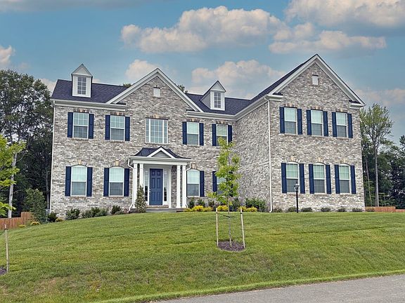 Kingsport II - Elevation 3 shown with 3-Car Side Load Garage with Extended Sitting Room above garage