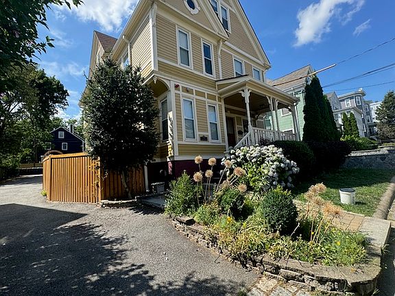 Front of house. The fence to the left encloses this unit's private patio.