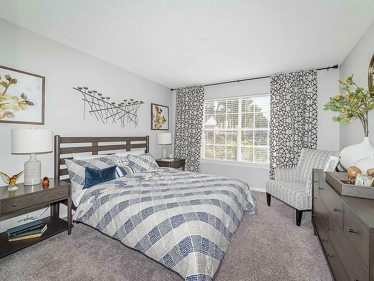 Experience the comfort and style of this beautifully designed bedroom, offering a serene retreat.