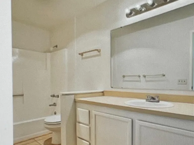 Full bath on the upper floor before new bathtub & new vanity, new cabinet & new floor installed on May 2026.