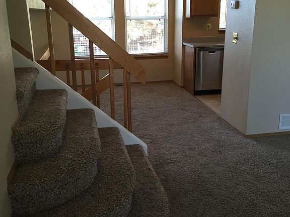 Open split level floorplan with large windwos and vaulted ce