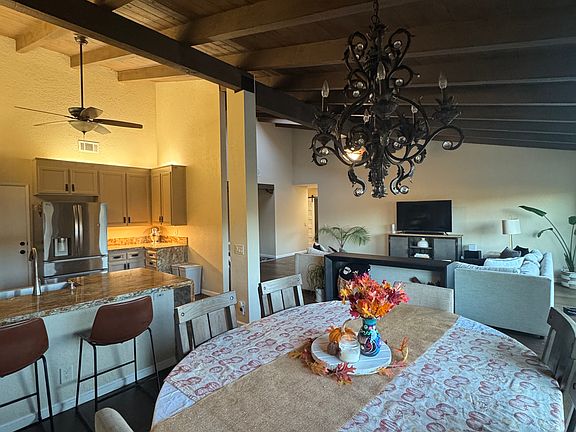 Dining room + kitchen + living room view