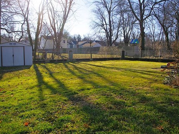 Fenced rear yard with shed