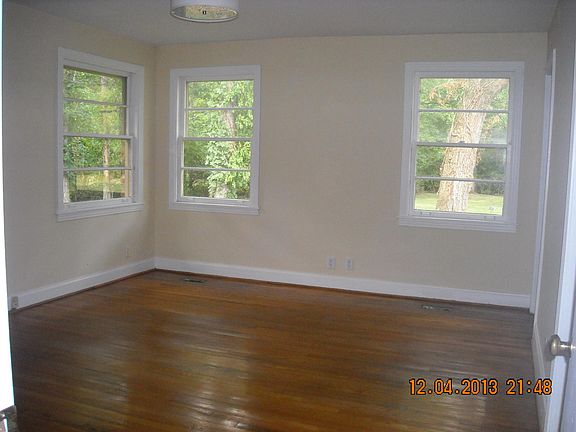 Master Bedroom with view of Side Yard (toward Creek) and Bac