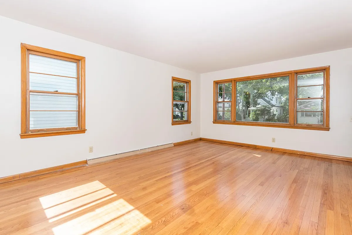 Large living room with hardwood floors. - 2333 Hoard St #1