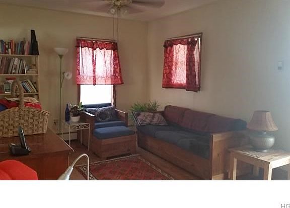 Large living room, 23' long, offers plenty of room for entertaining. Other end is used as home offic
