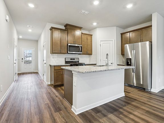 The Amber floorplan in the Charm Burlap interior package.