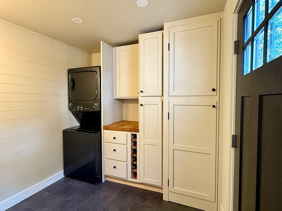 Custom storage, built-in wine rack, and brand new washer/dryer