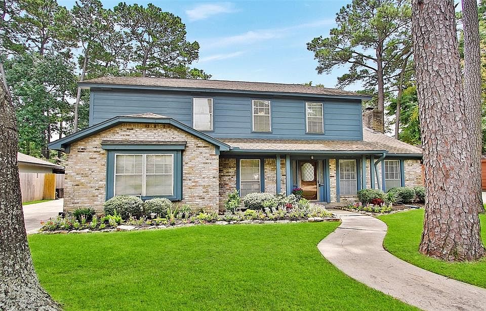 3215 Flaming Candle Dr. Mature trees and freshly updated landscaping give this home great curb appeal.