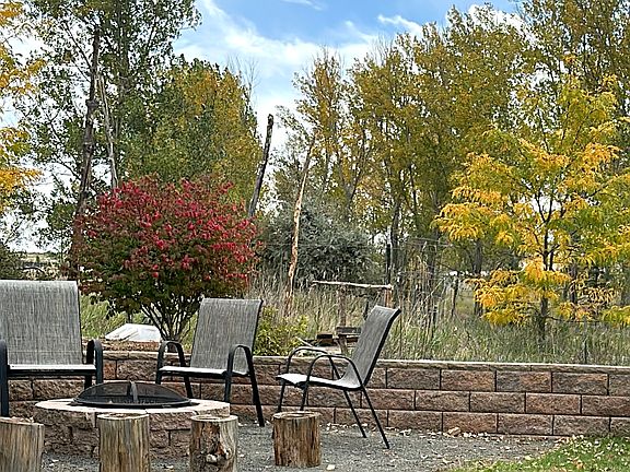 Fire pit and seating area, backs to open space