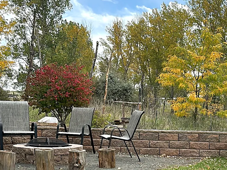 Fire pit and seating area, backs to open space
