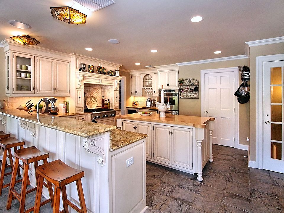 Stunning custom kitchen complete with warming drawers!