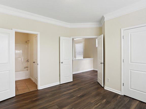 Main Level Bedroom with view of Bath and Foyer