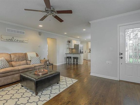 Beautiful wood floors flow across the main level.