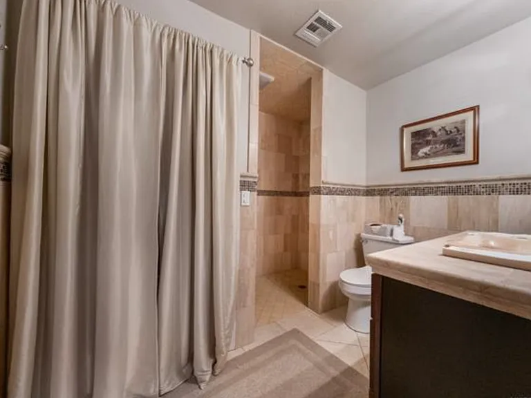 Private bath off of ground floor bedroom or 2nd living space