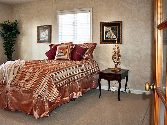 Large master bedroom is on the main level & offers His & Her closets