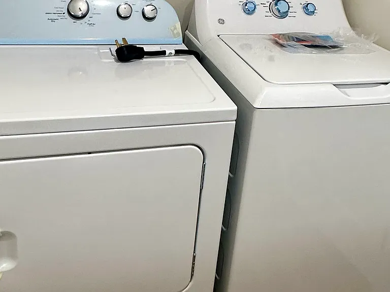 Side-by-side washer and dryer conveniently located on the second floor for easy access.