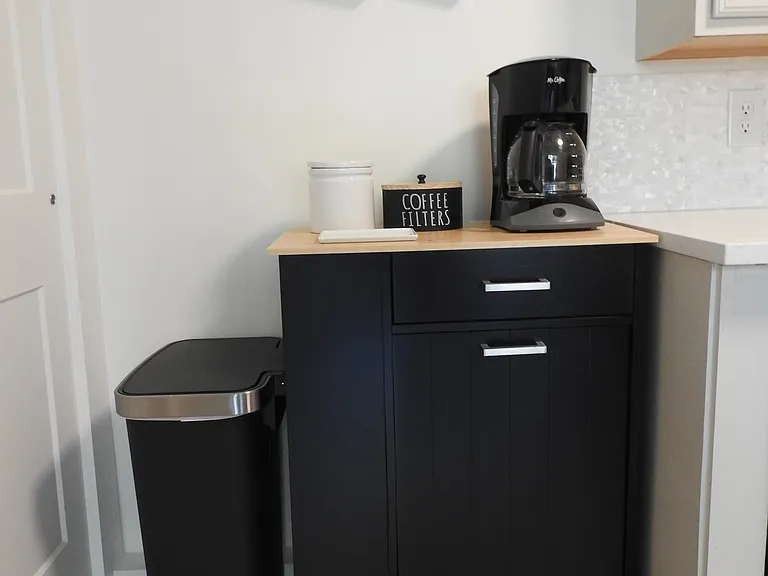 Cute coffee station and rubbish area.