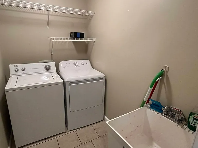 Laundry room with wash basin
