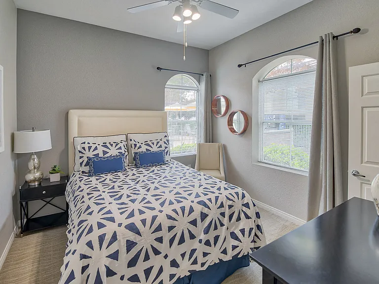 Arched windows in select bedrooms