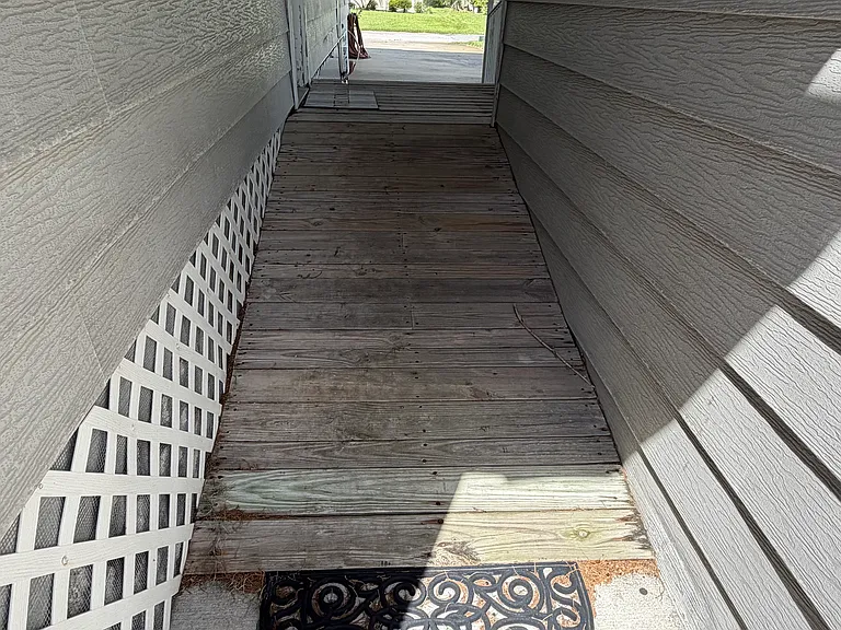 Ramp from front door to concrete path to dock