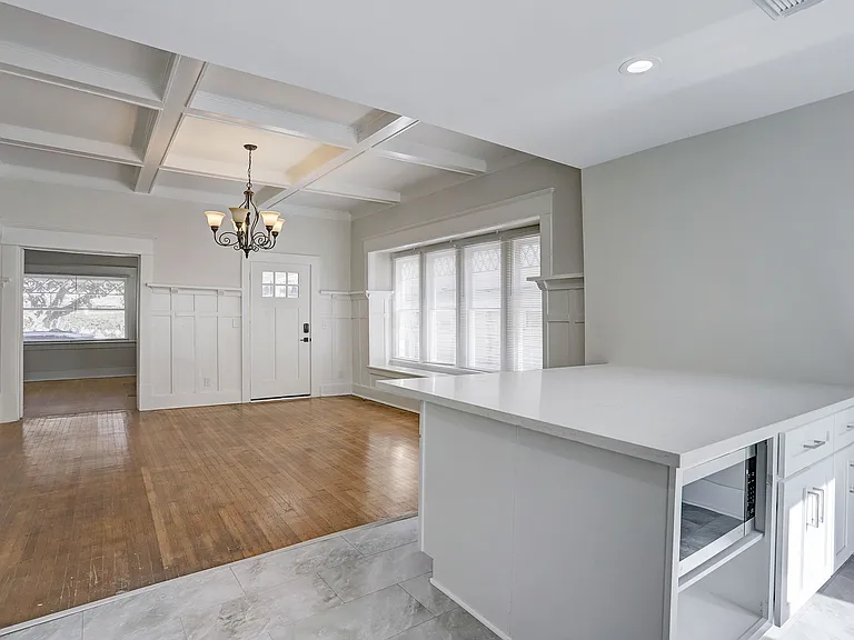 Island includes a hide-away space for microwave, keeping your counter space clean.