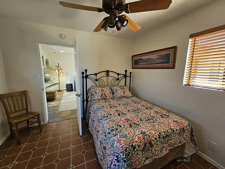 Second bedroom has full size bed and ensuite bath. It's off the living room, so a split floor plan. The MBR is on the other side of the house.