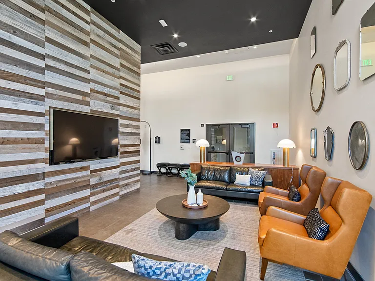 Common Area with Television and Couches at Aventine Apartments in Hercules, CA 94547
