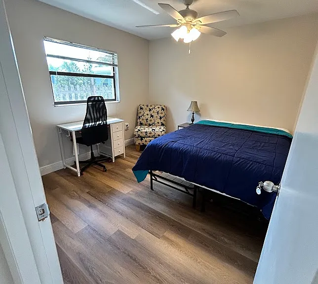 Bedroom 3 - Queen mattress, desk with chair, side table with lamp, chair, dresser