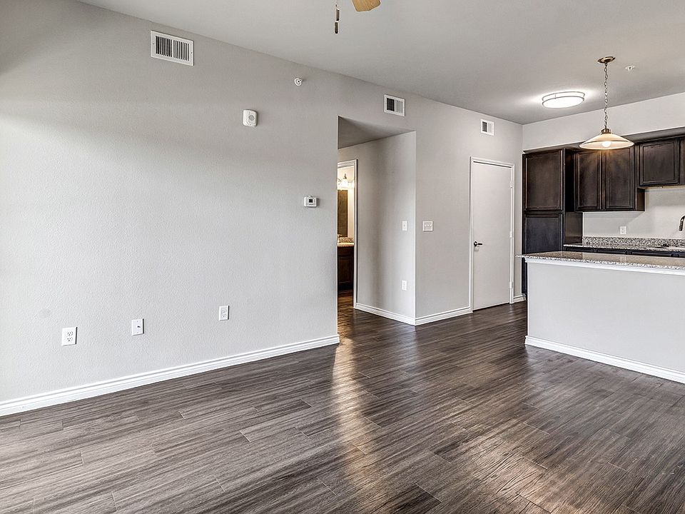 Large living spaces with wood inspired flooring