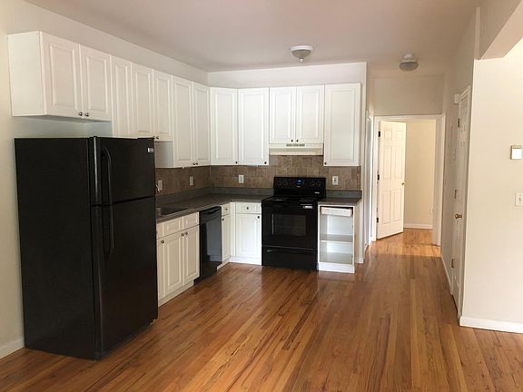 Cabinet at right has been repaired and all doors are now on. Notice gleaming real oak floors.