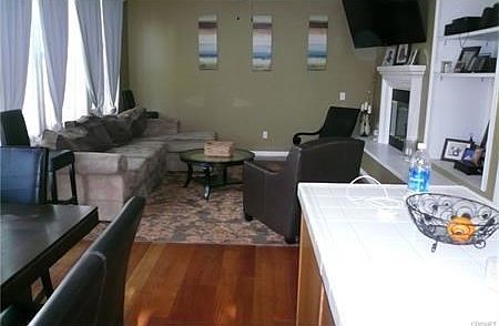From kitchen looking to family room, back door to the left.