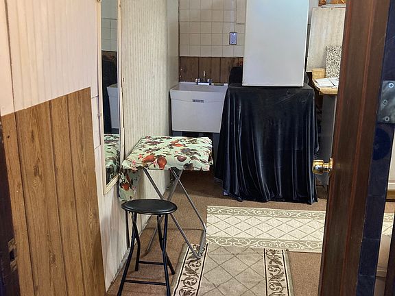 Small apartment entrance into kitchenette, smaller kitchenette, sufficient to cook food