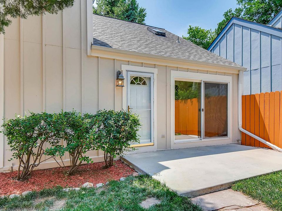 Front of house showing sliding door adjacent to dining room.