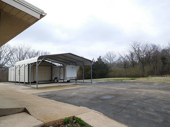 Storage building and carport
