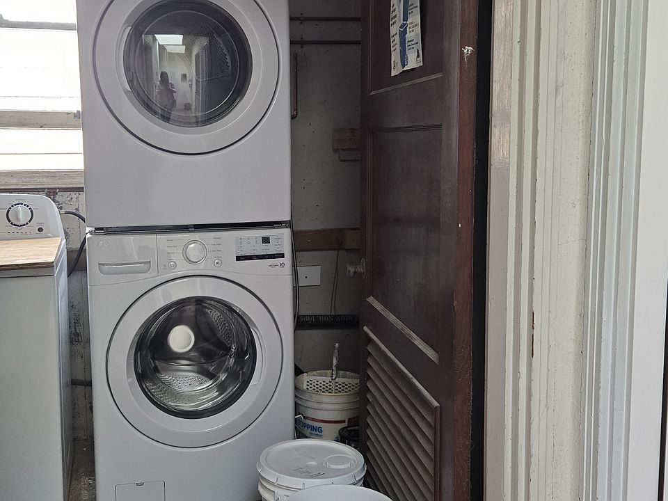 Private laundry machine located outside the front door