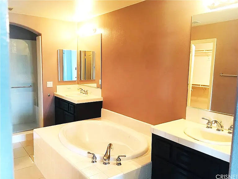 Primary Bathroom with Walk-In Closet