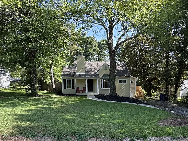 2nd parking area to the left of house
