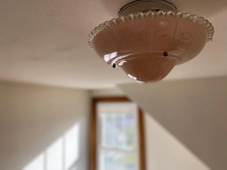 Beautifully restored vintage fixtures in bedrooms.