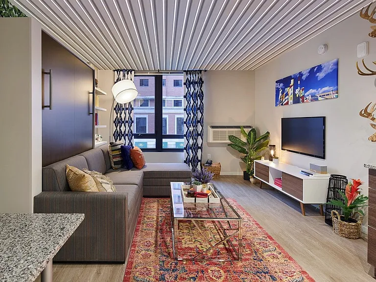 63 E Lake Apartments studio living room