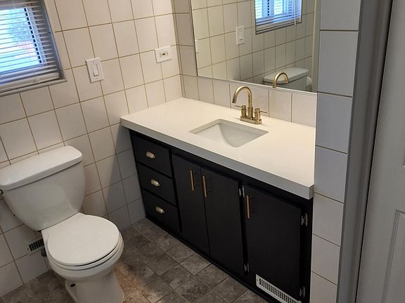 Full bathroom with tub upstairs. White quartz counter top on vanity.