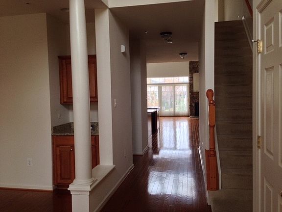 View from front door, dining room with wet bar on left