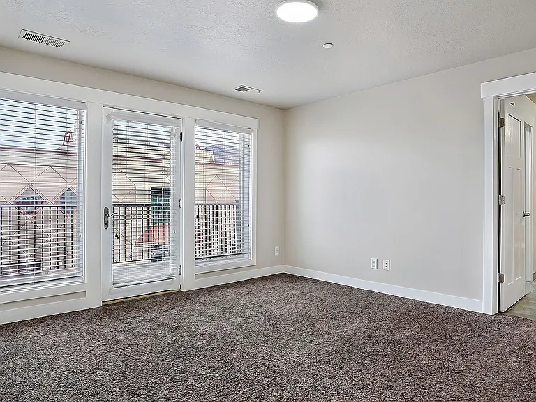 Comfortable bedrooms offer natural light and convenient access to private bathrooms.