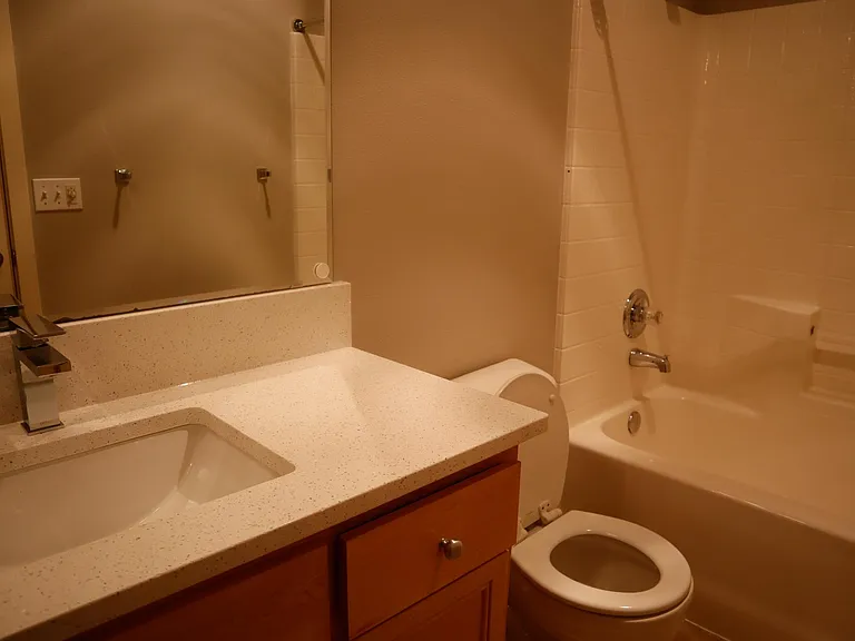 Second Bathroom with new quartz countertop, sink and faucet.