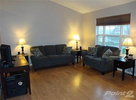 Another view of the living shows the large front window providing a lot of natural lighting. Beautif