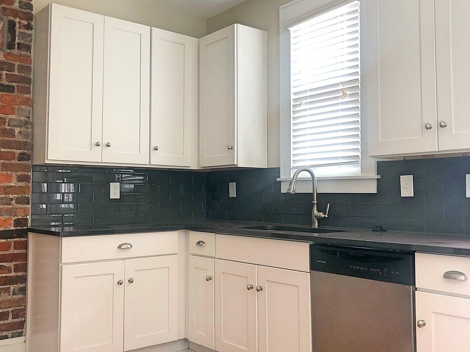 Remodeled kitchen with granite counters and stainless appliances