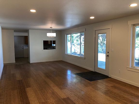 Dining room (viewed from living room) with newly installed light fixture.