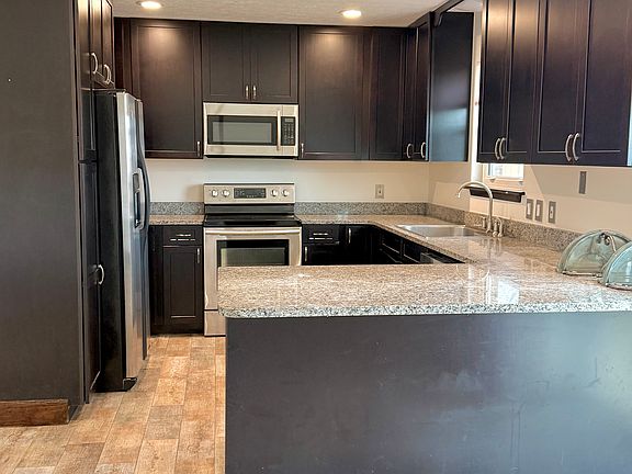 Stainless steel appliances and granite countertops. Large sink and plenty of storage