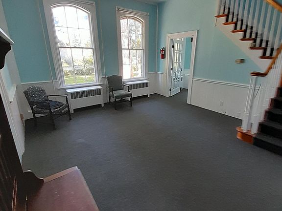 large living room first floor, tall ceilings, big windows