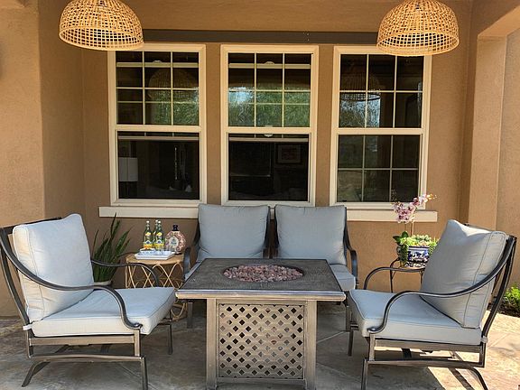 These lounge chairs rock back and forth, propane fire pit, shaded by the balcony above, ahhhh. Another drink please.